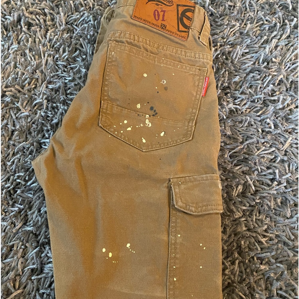 Men Square brown painters jeans has cream dots.